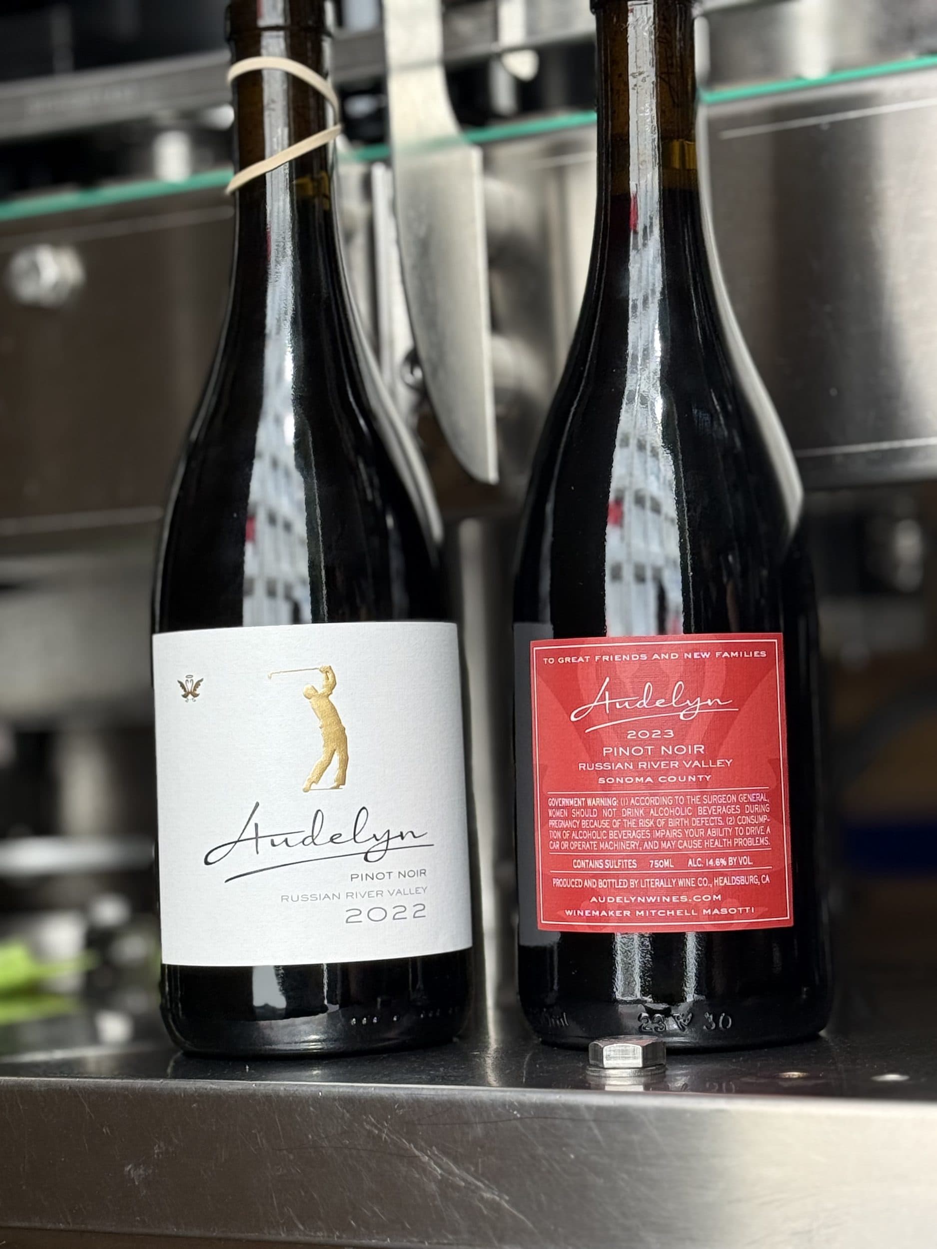 Audelyn Pinot Noir and red label bottles
