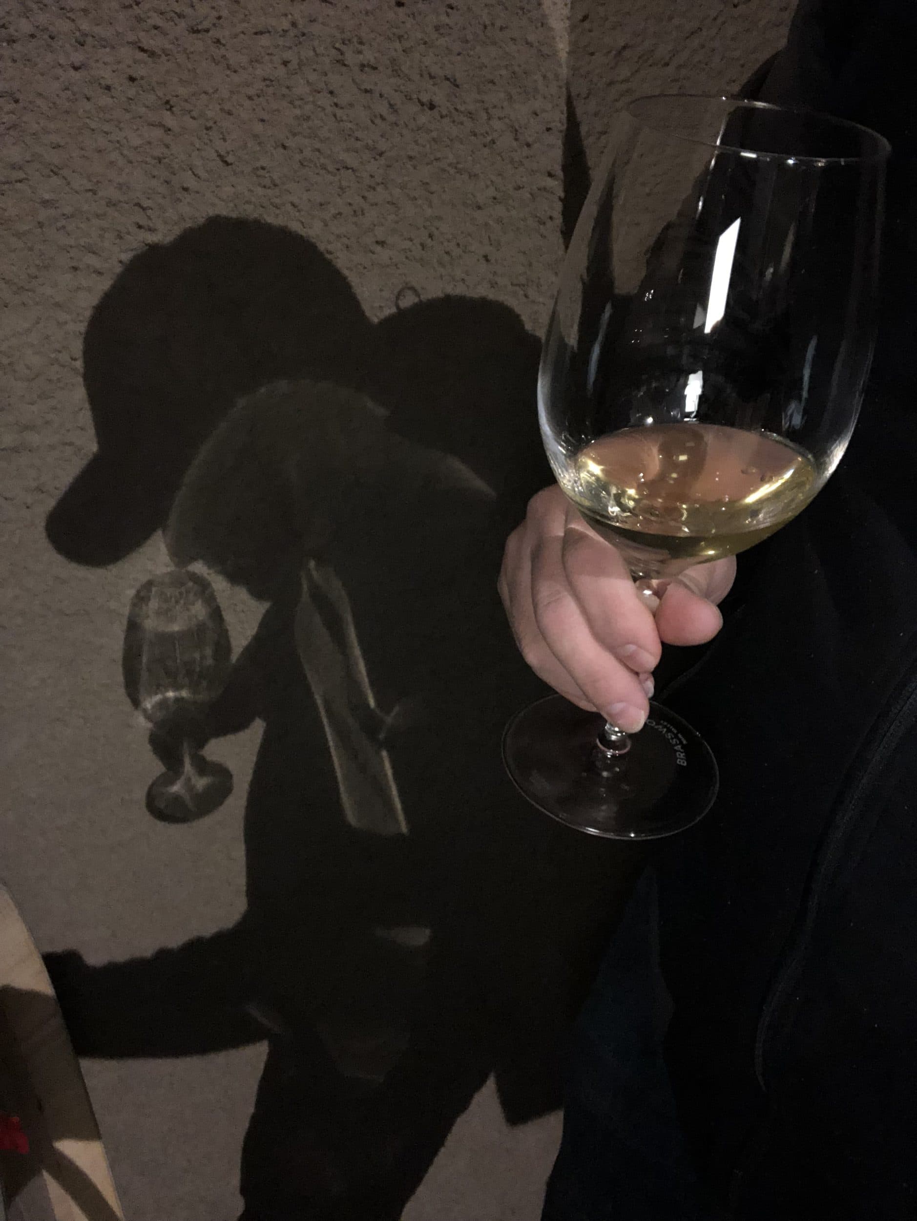 A glass of Chardonnay casting a shadow